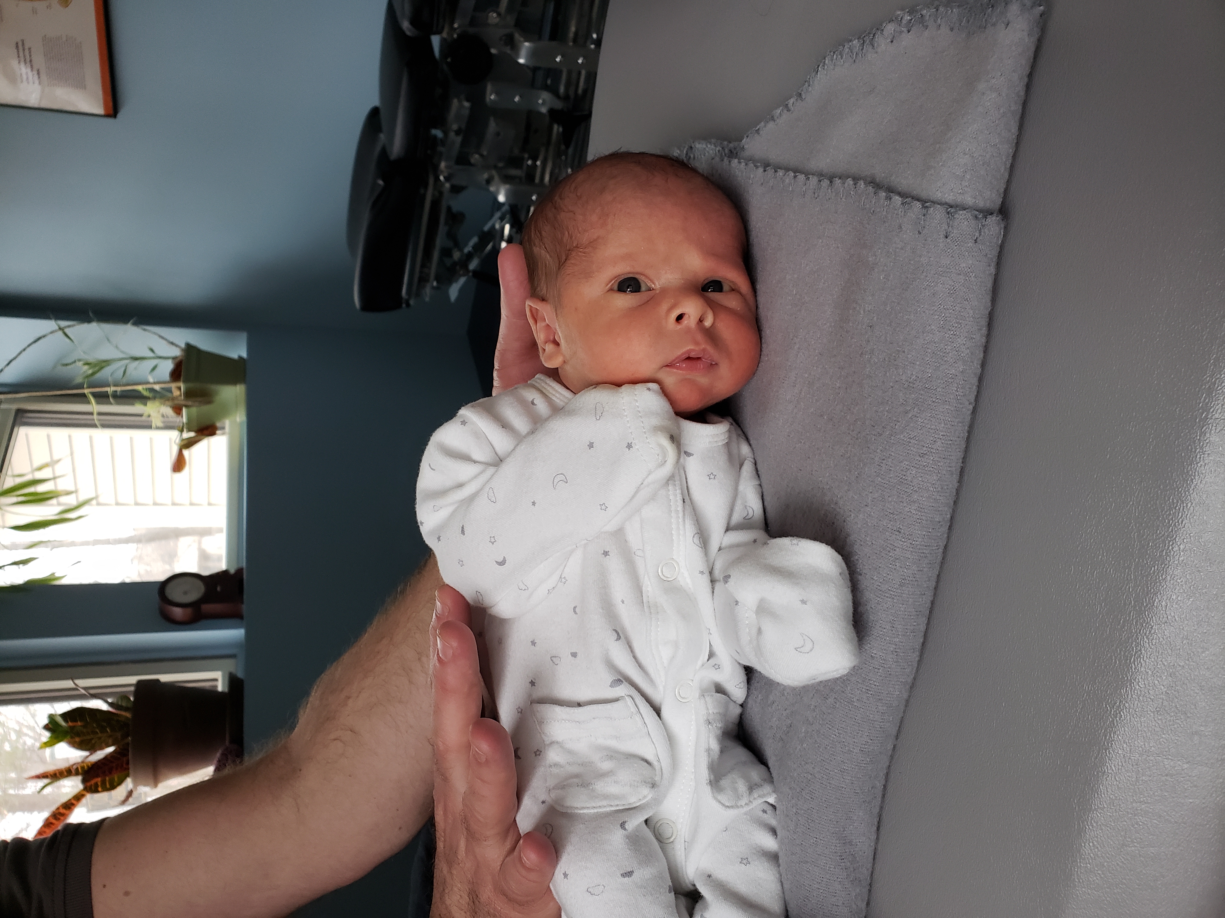 Newborn baby during a chiropractic visit at Community Chiropractic