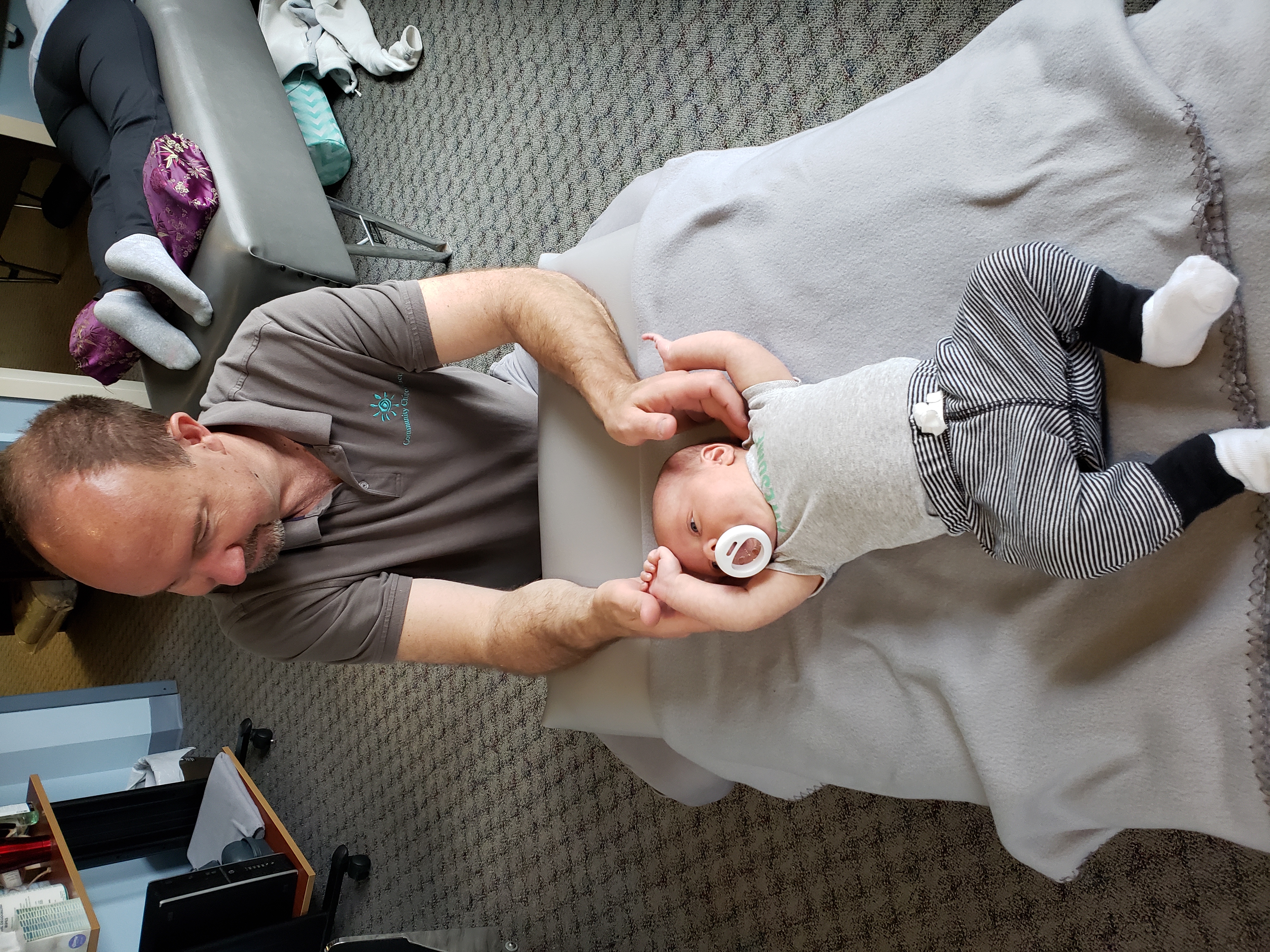 Dr. Steve providing gentle chiropractic care to a young infant