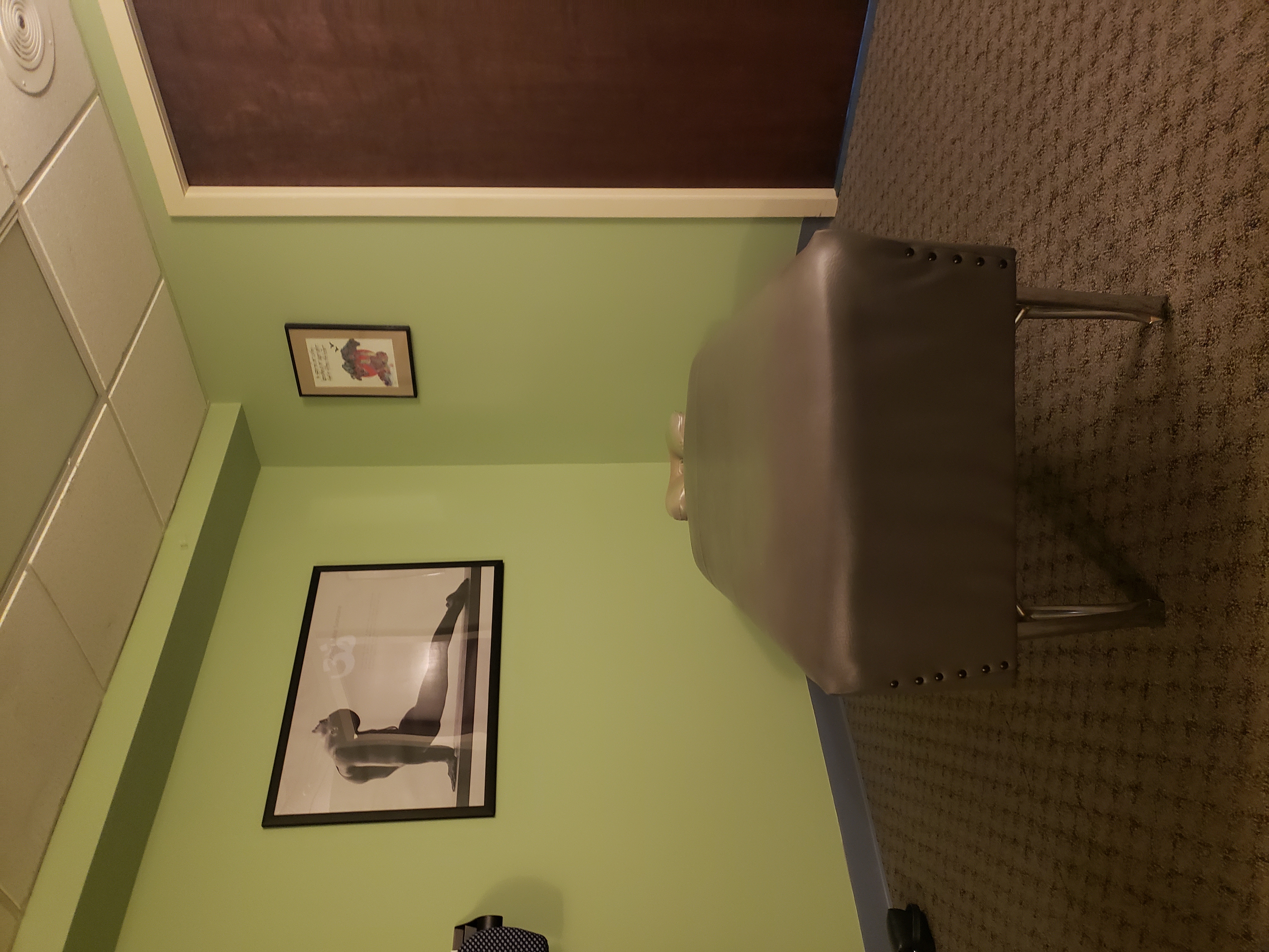 Clean chiropractic treatment room with adjusting table