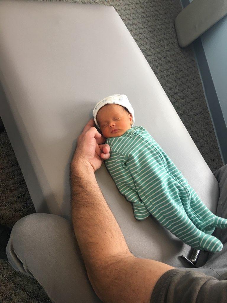 Dr. Steve supporting a newborn during a gentle adjustment