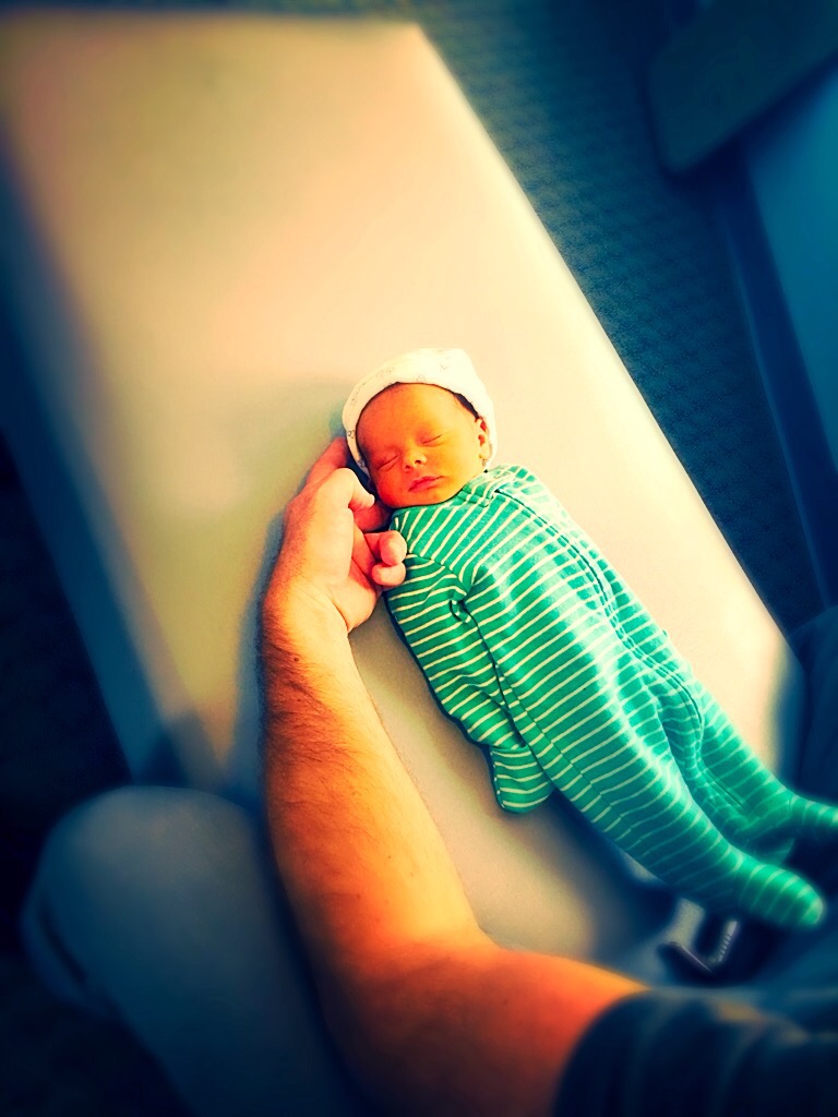 Dr. Steve providing chiropractic care to a newborn baby